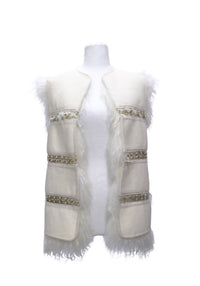 Chloé ivory sleeveless vest featuring a cream wool-like exterior, long-haired white fur trim, decorative gold-tone metal embellishments,  an open-front silhouette.