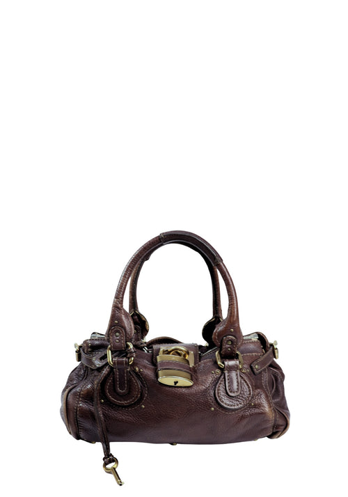 Authentic Chloé Paddington satchel bag in brown grained leather featuring the iconic oversized gold-tone padlock, dual rolled handles, exterior flap pockets, and antique gold hardware