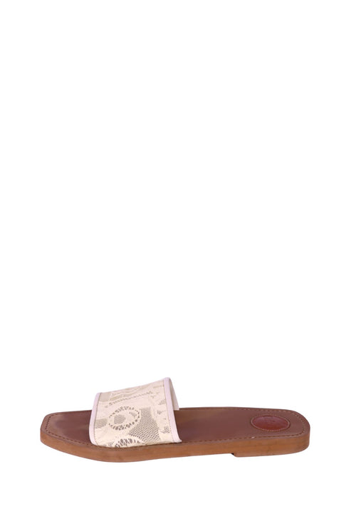 Chloé cream lace slide sandals with brown leather footbed, flat minimalist design