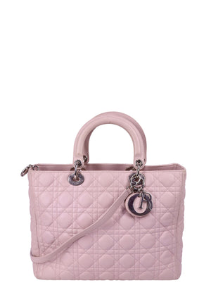 Christian Dior light pink Lady Dior bag with Cannage quilting, structured top handles, and silver-tone Dior charm details