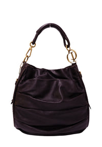 Christian Dior dark brown leather hobo bag with gold-tone CD hardware, leather-wrapped shoulder handle, and a soft slouchy silhouette