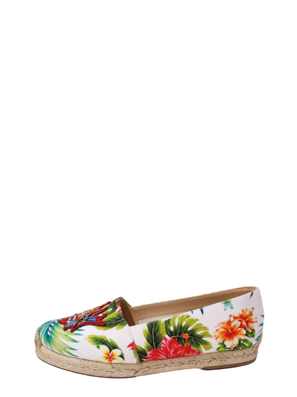 Authentic Christian Louboutin Dandelion canvas espadrilles featuring a tropical Hawaiian floral print, embroidered crest, and braided jute sole.