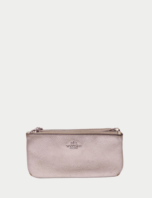 Coach metallic silver leather wristlet with embossed logo and zip closure