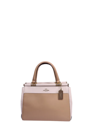 Coach colorblock leather carryall tote handbag in beige and blush pink with gold-tone hardware, dual top handles, and Coach leather hangtag.