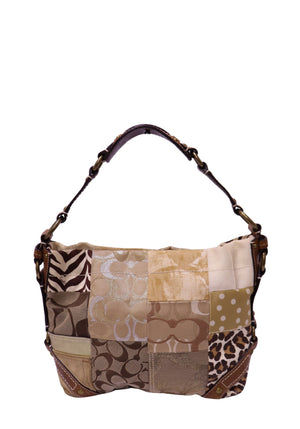 Coach patchwork shoulder bag crafted from signature canvas, leather, and mixed-print fabrics with brown leather trim and brass-tone hardware.