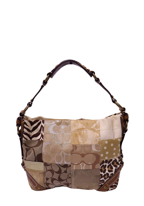 Coach patchwork shoulder bag crafted from signature canvas, leather, and mixed-print fabrics with brown leather trim and brass-tone hardware.