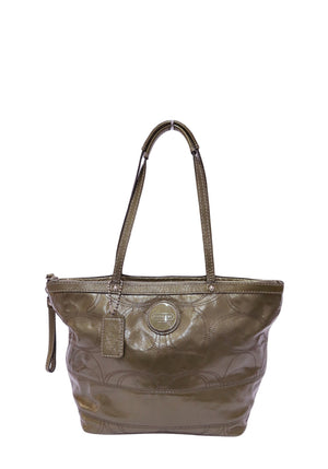 Coach olive green patent leather tote bag with embossed Signature pattern and dual shoulder straps.