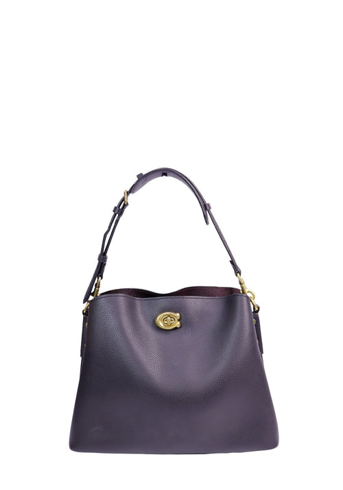 Coach Willow black pebbled leather hobo shoulder bag with antique gold-tone turn-lock closure and adjustable shoulder strap.
