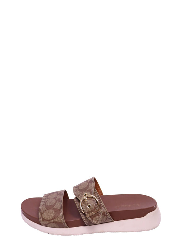 Coach slide sandals featuring signature khaki and brown monogram jacquard straps, an adjustable gold-tone buckle, cushioned brown footbed
