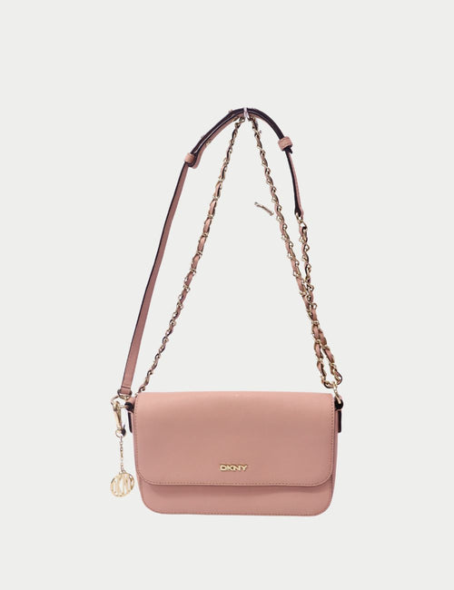 DKNY pink leather shoulder bag with flap closure, gold-tone logo, and chain-and-leather strap
