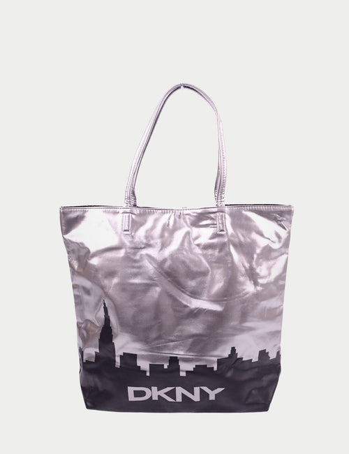 DKNY metallic silver tote bag with NYC skyline print