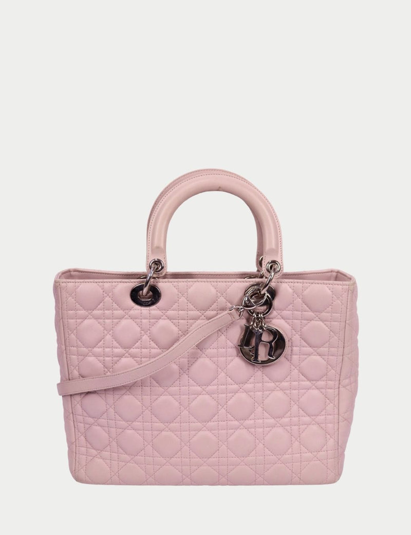 Christian Dior Lady Dior blush pink quilted leather tote with Cannage stitching, top handles, and silver Dior letter charms