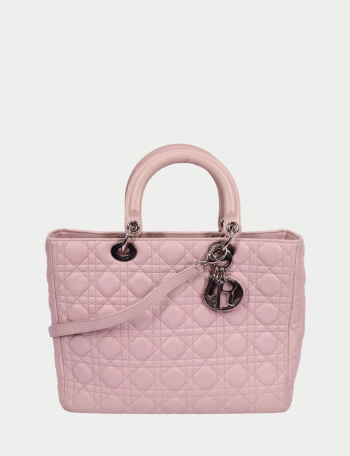Christian Dior Lady Dior blush pink quilted leather tote with Cannage stitching, top handles, and silver Dior letter charms