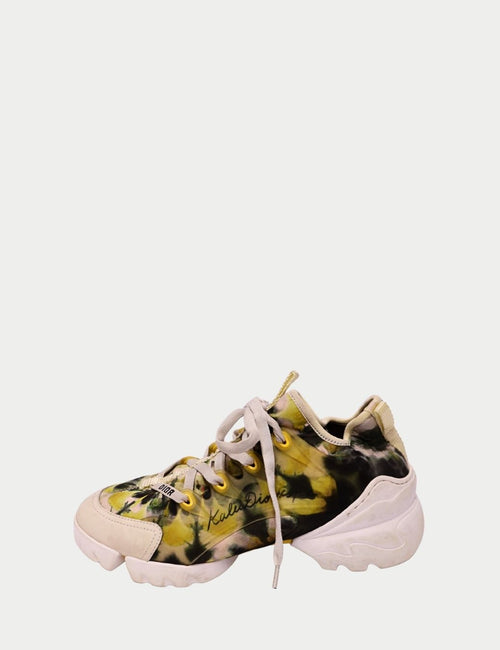 Christian Dior low-top sneakers with green and yellow tie-dye design, lace-up closure, and chunky white rubber sole