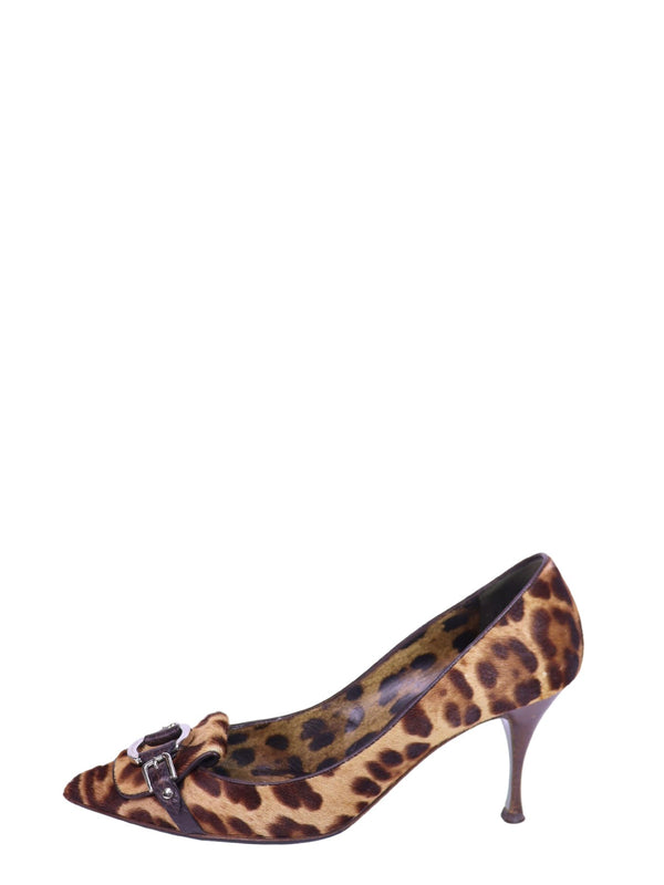 Dolce & Gabbana leopard print pony hair pointed heels with brown leather buckle detailing and slim heels.