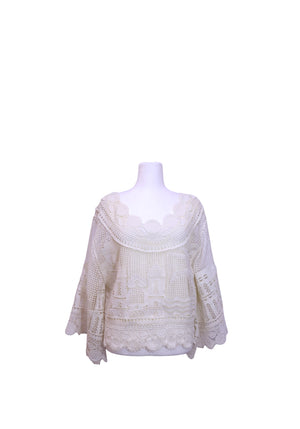 Farm Rio off-white crochet blouse featuring an intricate cityscape motif, floral lace neckline, relaxed fit, and three-quarter sleeves