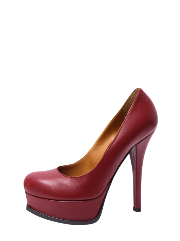 Fendi burgundy leather platform pumps featuring rounded closed toes, thick front platforms, towering stiletto heels and tan interiors