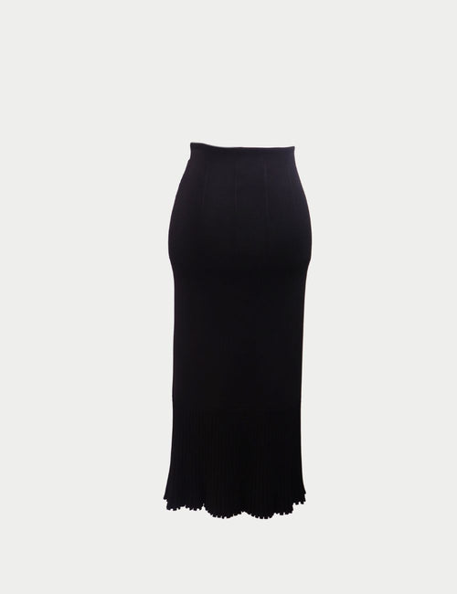 Galvan London black knit maxi skirt with high waist, bodycon fit, and pleated hem detail