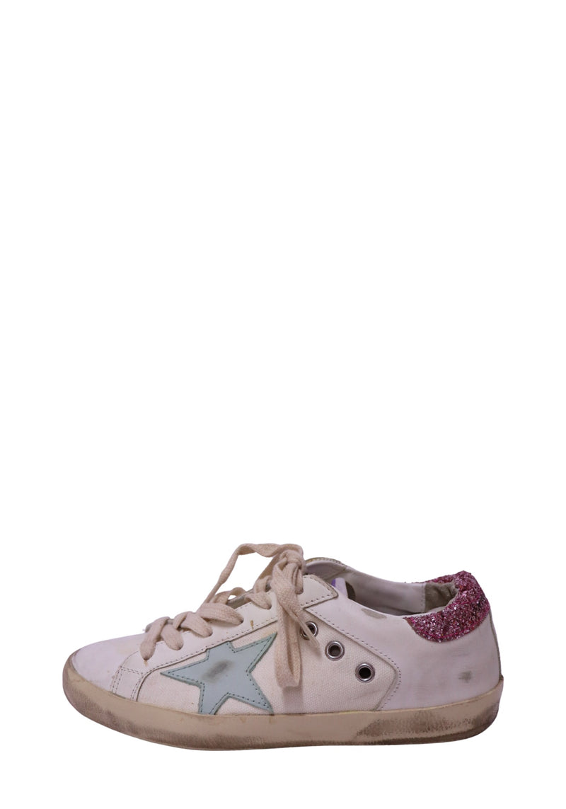Authentic Golden Goose Super-Star white leather low-top sneakers featuring an ice blue leather star, pink glitter heel tab, distressed rubber sole, and lace-up