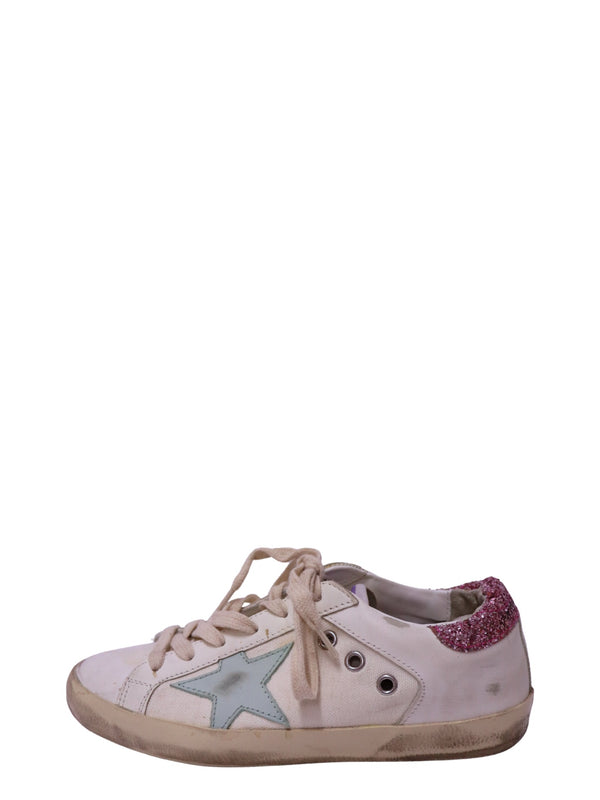 Authentic Golden Goose Super-Star white leather low-top sneakers featuring an ice blue leather star, pink glitter heel tab, distressed rubber sole, and lace-up
