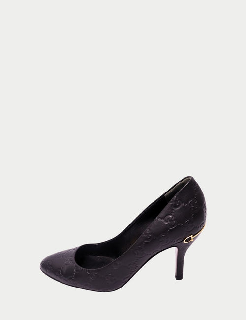 Gucci black leather pumps with embossed GG monogram and pointed toe – Italian designer heels