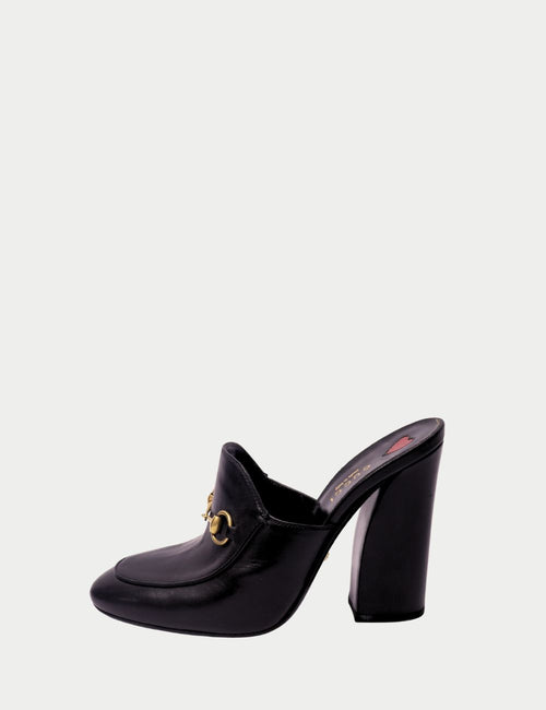 Luxury Gucci slip-on black pumps featuring chunky heel and signature horsebit hardware
