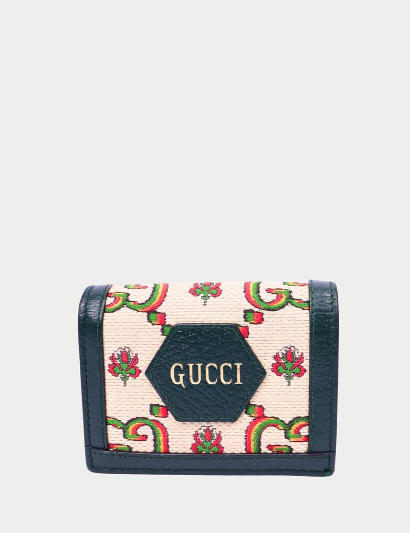 Gucci floral print leather wallet with green trim and logo plaque