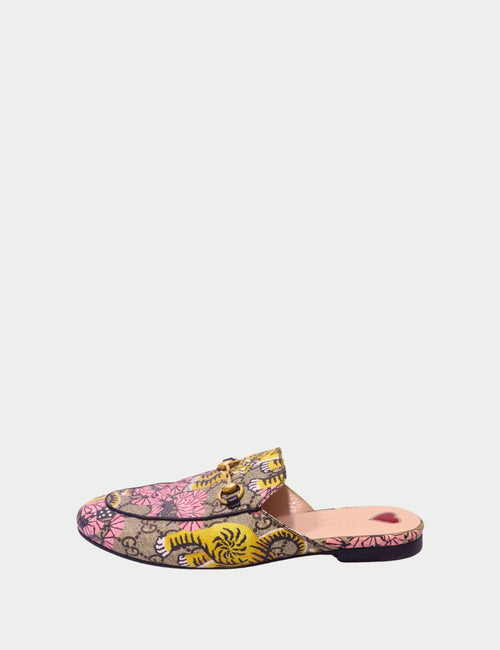 Luxury Gucci slip-on mules in multicolor print with signature horsebit hardware