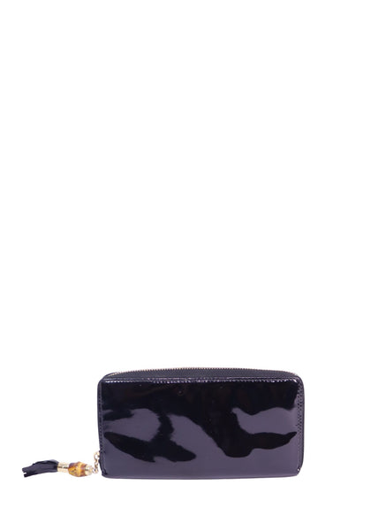 Gucci black patent leather zip-around wallet featuring a glossy finish, gold-tone hardware, and signature bamboo zipper pull detail