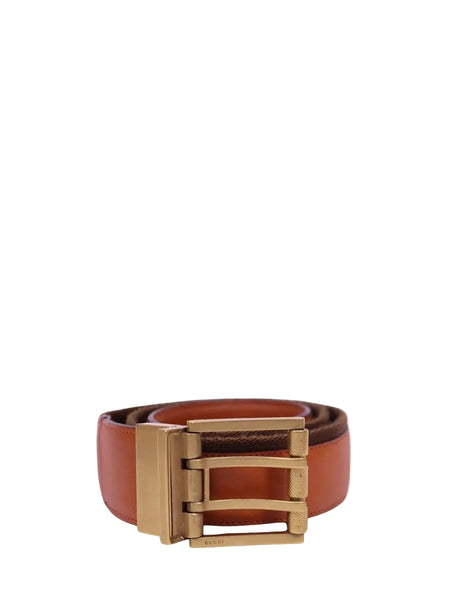 Gucci brown leather belt with structured design and matte gold-tone buckle