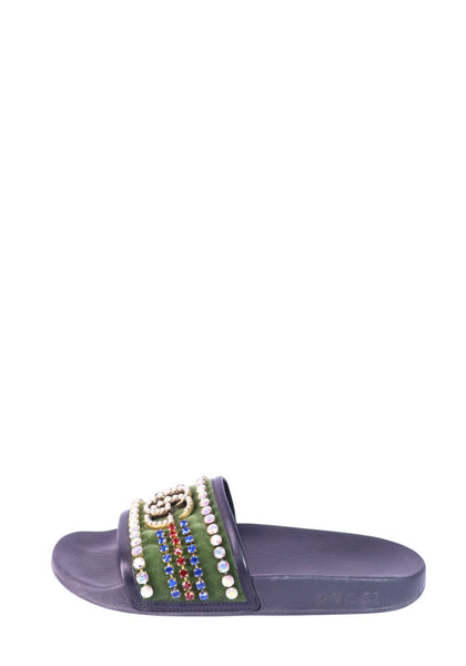 Gucci black slide sandals with crystal embellished straps and interlocking GG logo detailing.