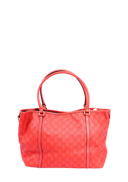 Gucci coral Guccissima leather tote bag with embossed GG monogram pattern, double leather handles, and silver-tone hardware, pre-owned luxury designer handbag