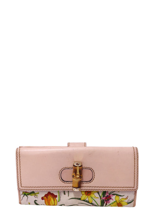 Authentic Gucci Bamboo 1947 continental wallet featuring Flora printed canvas, light beige leather trim, an iconic bamboo turn-lock closure, and gold-tone hardware.