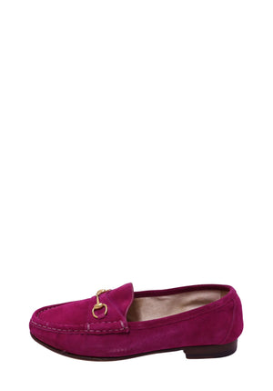 Authentic Gucci fuchsia suede loafers featuring signature gold-tone Horsebit hardware, moccasin stitching, and a classic slip-on silhouette