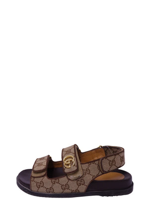 Gucci beige and brown GG monogram canvas sandals with gold Double G hardware, Velcro straps and black rubber sole