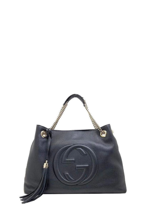 Gucci Soho black pebbled leather shoulder bag with embossed GG logo and tassel detail