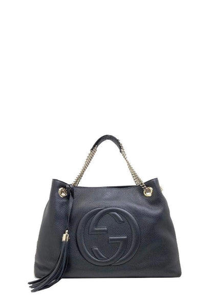 Gucci Soho black pebbled leather shoulder bag with embossed GG logo and tassel detail