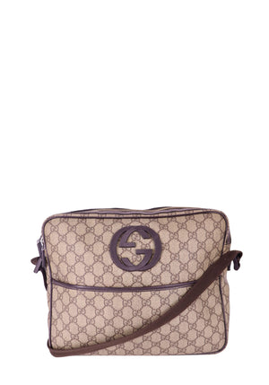 Gucci beige GG monogram canvas crossbody bag with brown leather trim and interlocking GG logo, adjustable strap