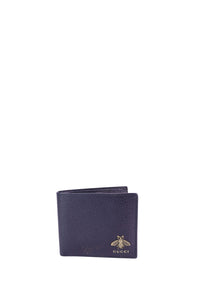 Gucci textured leather bifold wallet in dark navy with gold-tone bee logo detail on the front.