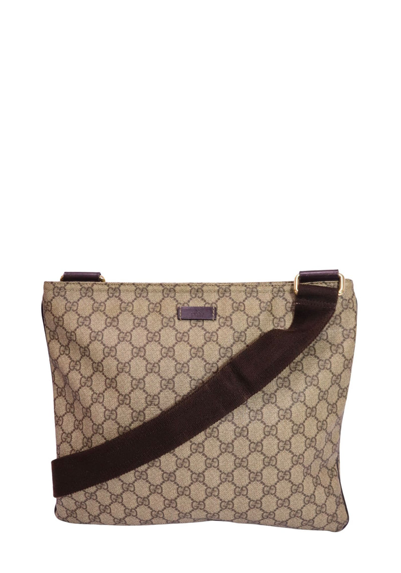 Authentic Gucci GG Supreme messenger bag in beige and ebony monogram canvas with brown leather trim, adjustable web shoulder strap, and zip-top closure.