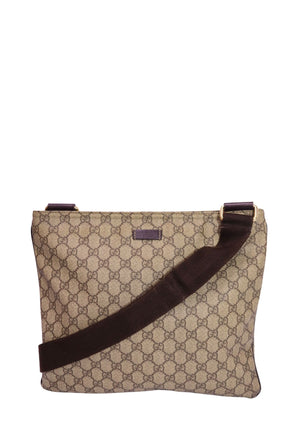 Authentic Gucci GG Supreme messenger bag in beige and ebony monogram canvas with brown leather trim, adjustable web shoulder strap, and zip-top closure.