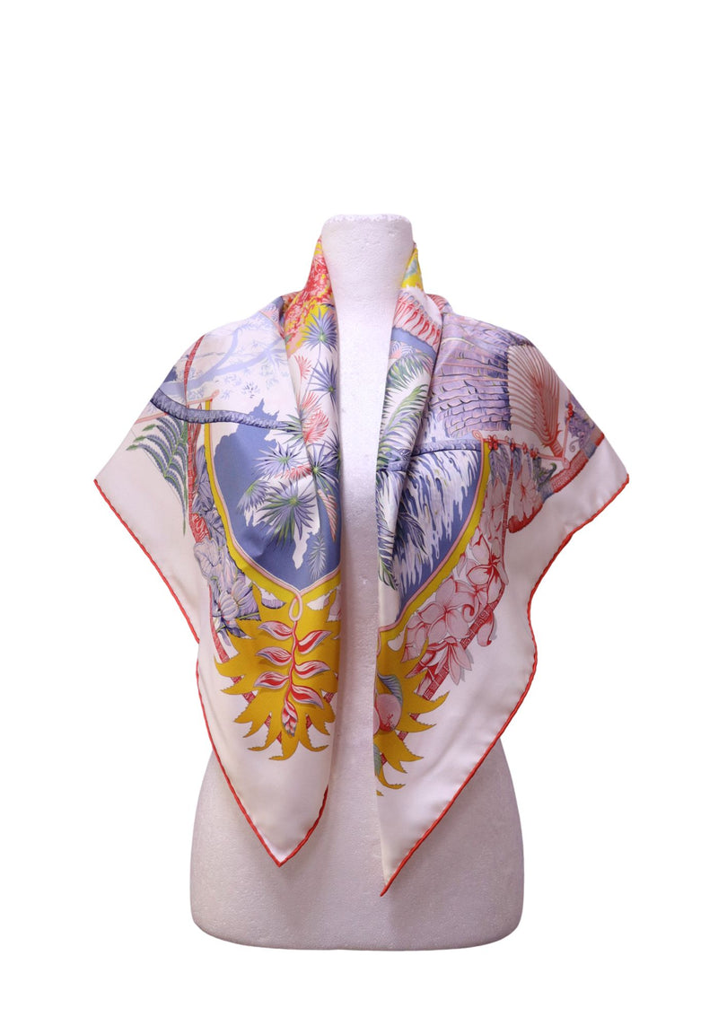 Authentic Hermès Aloha silk square scarf featuring colorful tropical artwork with palm trees, exotic flowers, birds, ocean waves, and a tree of life, shown from both front and reverse sides