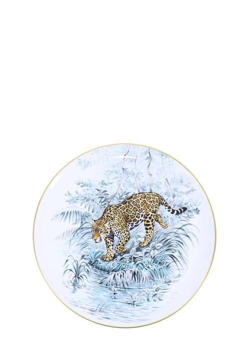 Hermès Carnets d'Équateur porcelain tart platter featuring a detailed jaguar illustration surrounded by tropical foliage and waterside scenery, finished with a delicate gold rim