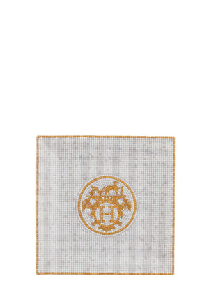 Authentic Hermès Mosaique au 24 square porcelain plate featuring a gold mosaic emblem and geometric border design.