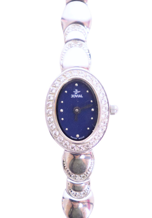 Jovial Swiss-made silver-tone watch with navy blue dial, crystal-set bezel, and oval case design