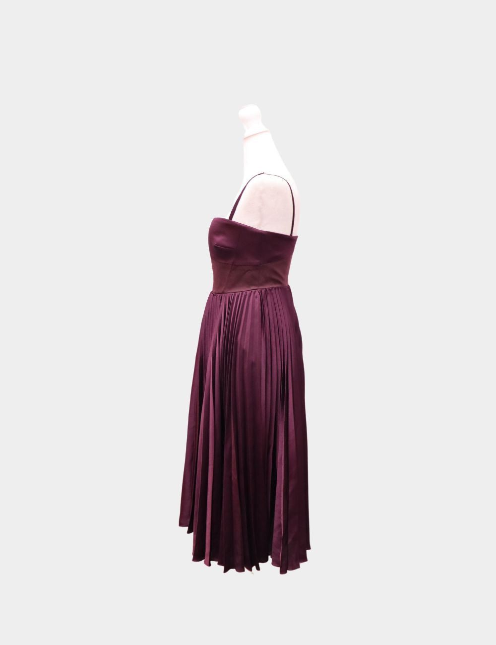 Elegance meets drama in this Karen Millen burgundy pleated midi dress, crafted in lustrous satin with a sculpted bodice and flowing pleated skirt. The flattering silhouette features delicate spaghetti straps and a fitted waist that effortlessly highlights Elegance meets drama in this Karen Millen burgundy pleated midi dress, crafted in lustrous satin with a sculpted bodice and flowing pleated skirt. The flattering silhouette features delicate spaghetti straps and a fitted waist that effortlessly highlights