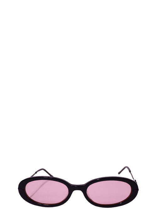 Authentic Karen Wazen black oval sunglasses with pink tinted lenses and a sleek minimalist acetate frame.