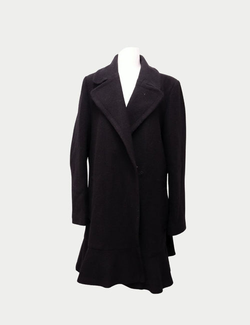 Kate Spade black mid-length wool coat with wide lapels and ruffle hem