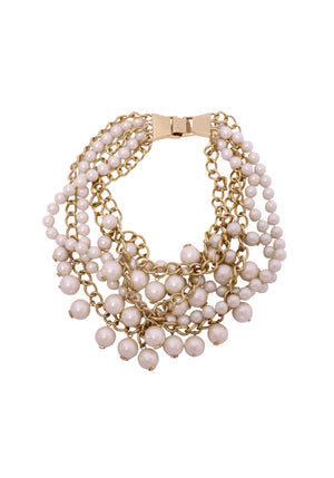 Authentic Kate Spade gold-tone multi-strand necklace featuring layered blush faux pearls and chain detailing.