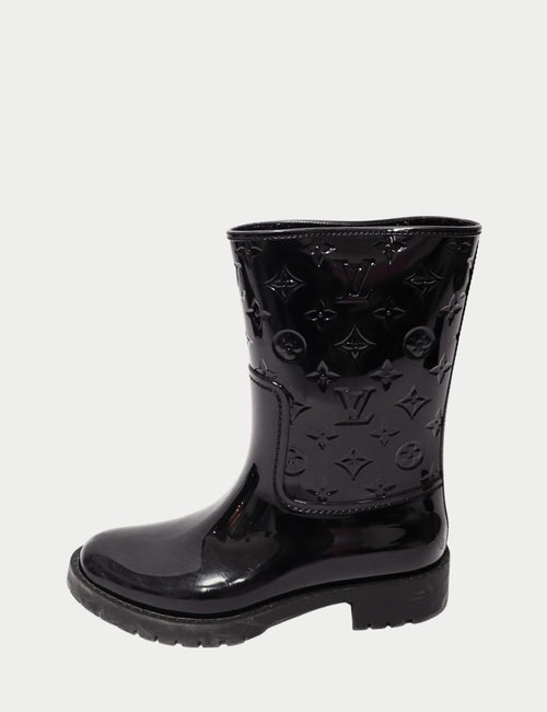 Louis Vuitton black monogram rain boots with embossed LV pattern and glossy finish